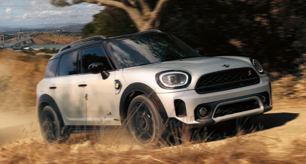 The MINI Cooper SE Countryman PHEV driving on dirt terrain. MINI of Pittsburgh in Pittsburgh PA
