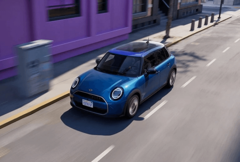 A guy charging his MINI car